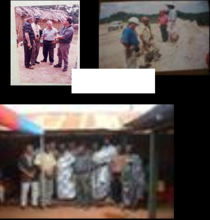 Douglas Macquarie and other Management with the local chief in a meeting-